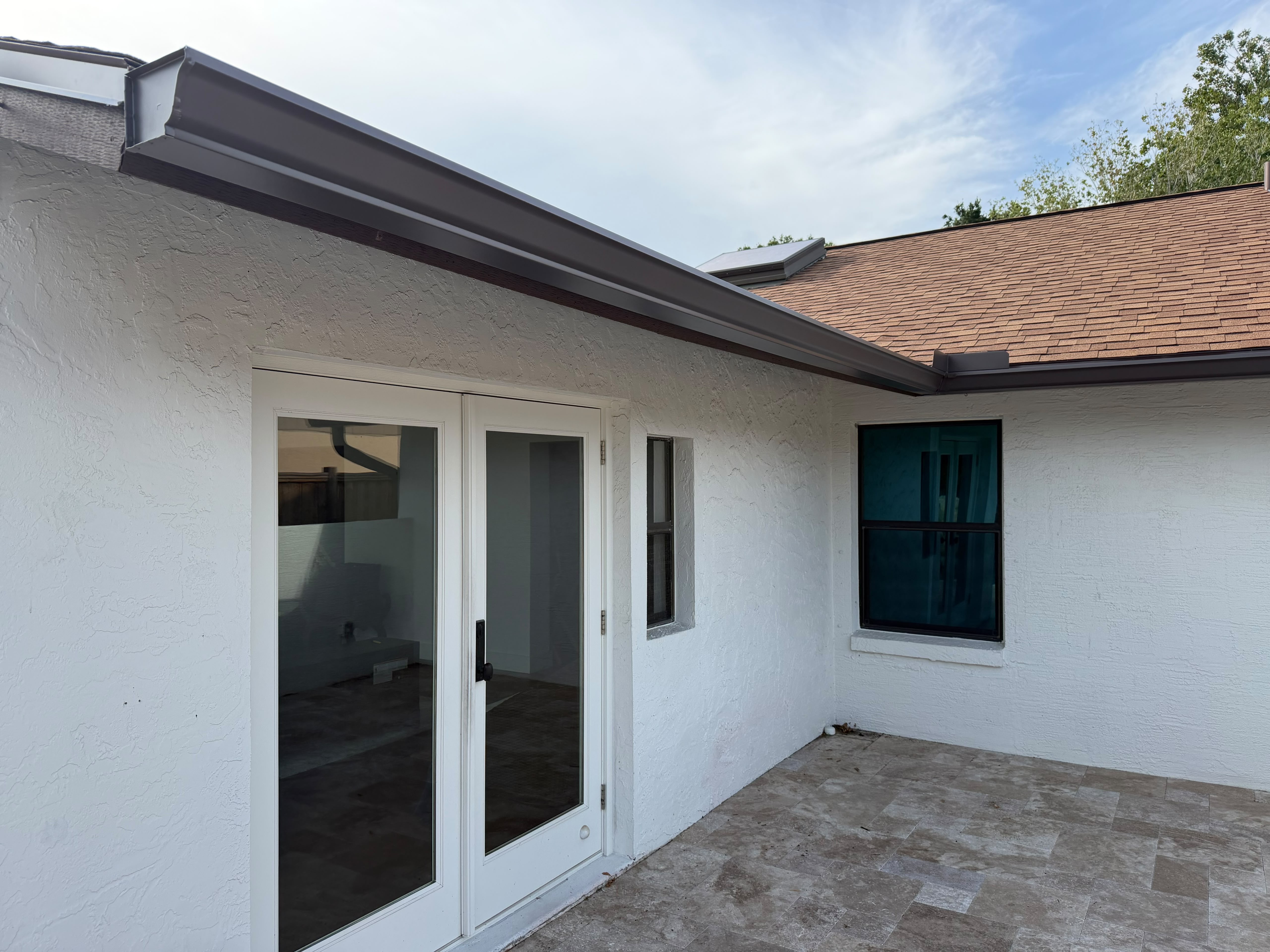 Dark gutter detail installed on a Florida home